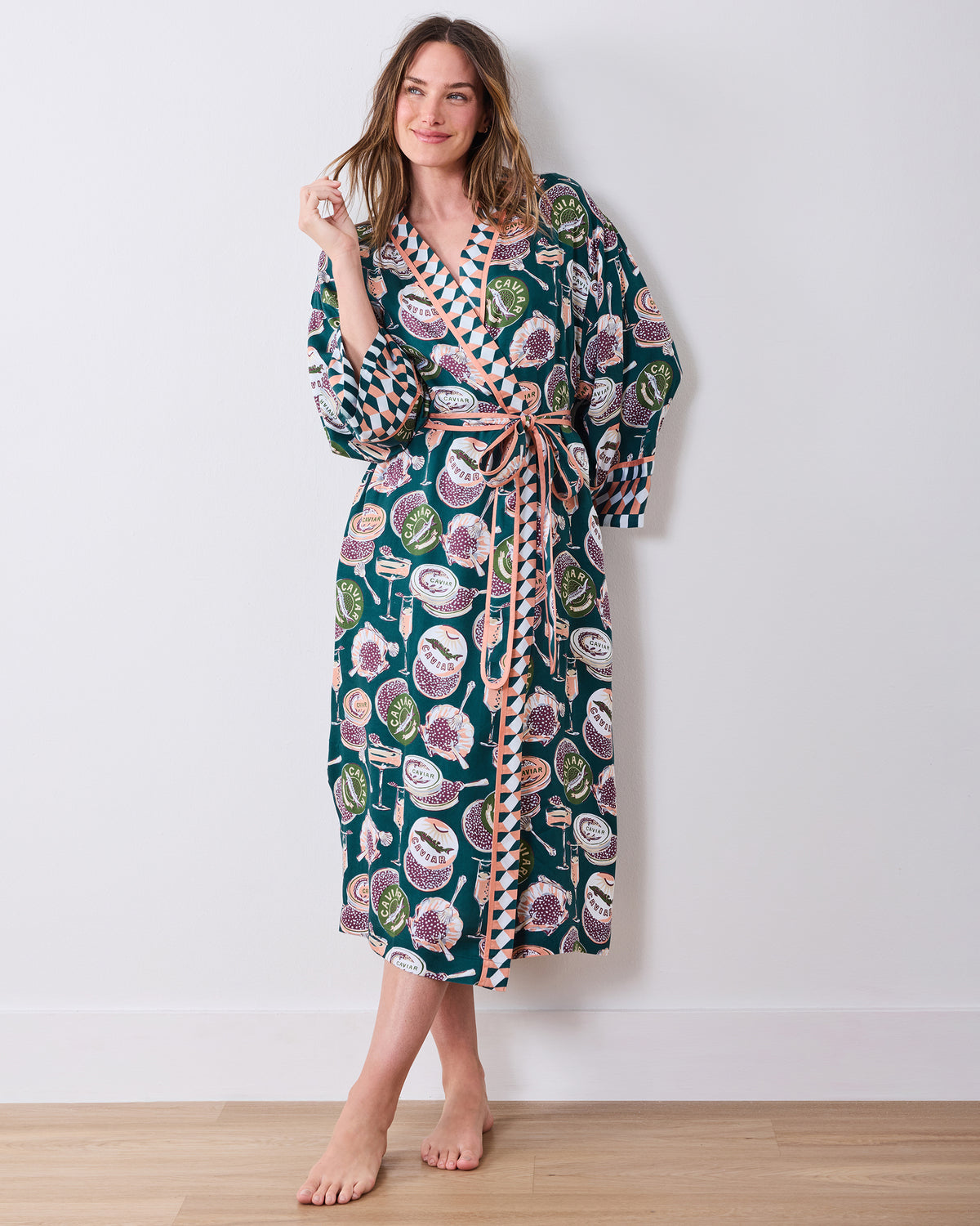 Full-length view of the printed wrap robe with long sleeves, contrast trim, tied belt, and pockets.