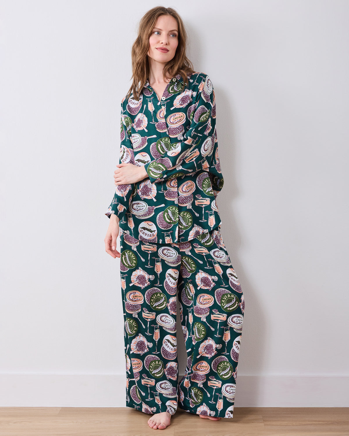 Front three-quarter view of the Champagne & Caviar Stevie pajama set with a button-front top and wide-leg pants.