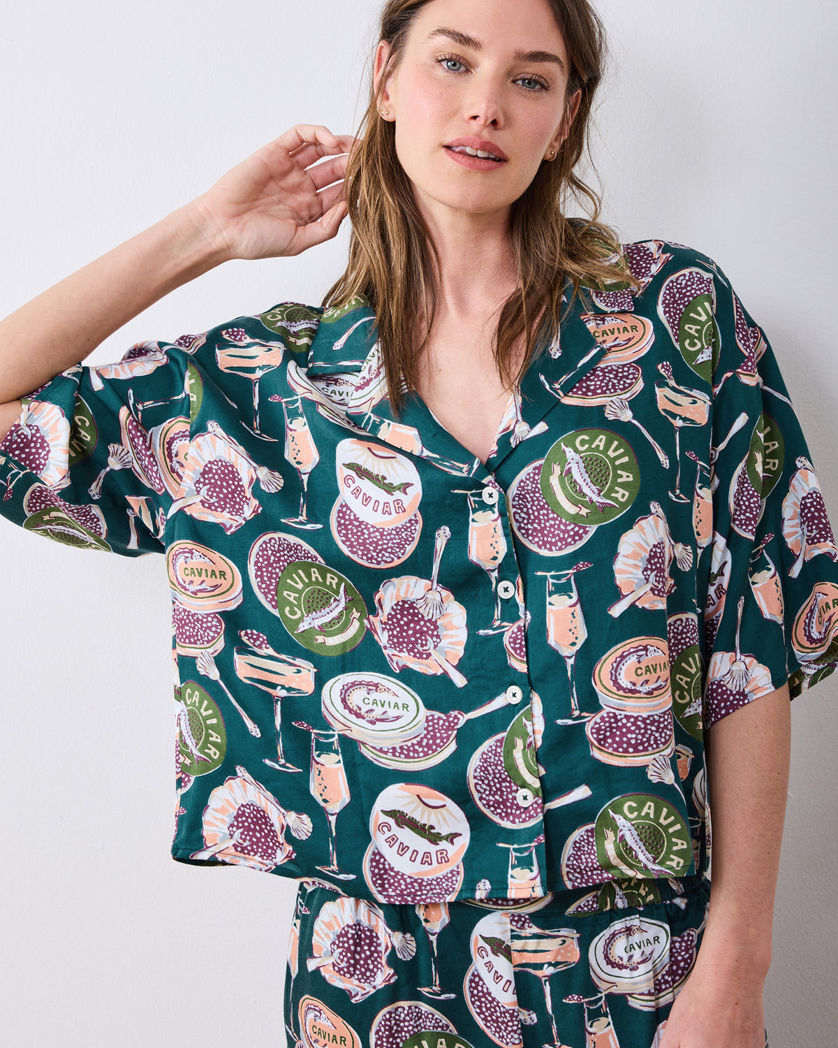 Front view of the petite Champagne & Caviar Wildest Dreams pajama top and waistband with the caviar-and-champagne print.