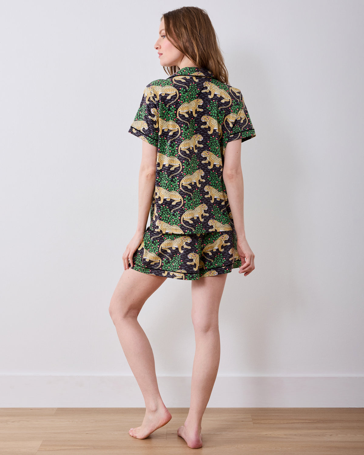 Back view of a person wearing the Bagheera short pajama set with a short-sleeved shirt and matching shorts.