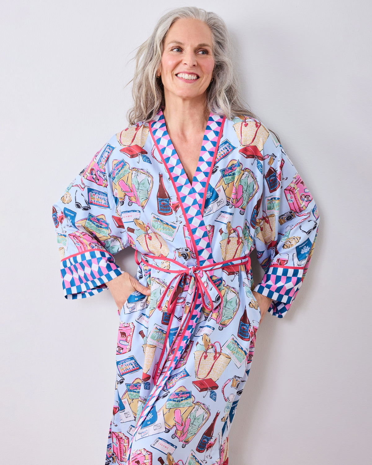 Full-length view of a person wearing the Emotional Baggage printed robe tied at the waist, with contrasting cuffs and matching belt.