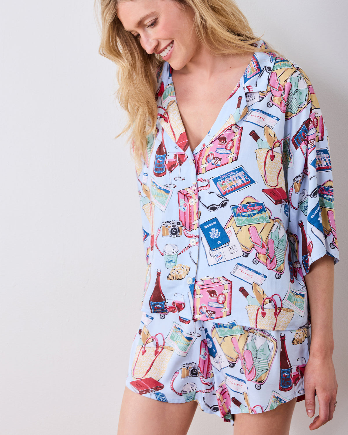 Angled close-up of the pale blue printed pajama top and matching shorts.