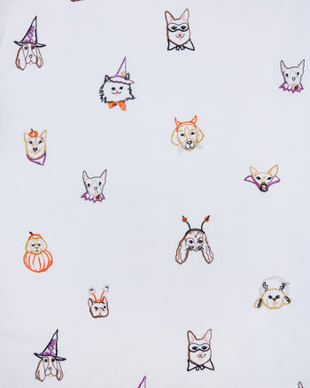 Seamless print of embroidered dog faces in Halloween costumes for the Halloween Hounds petite pajama set.