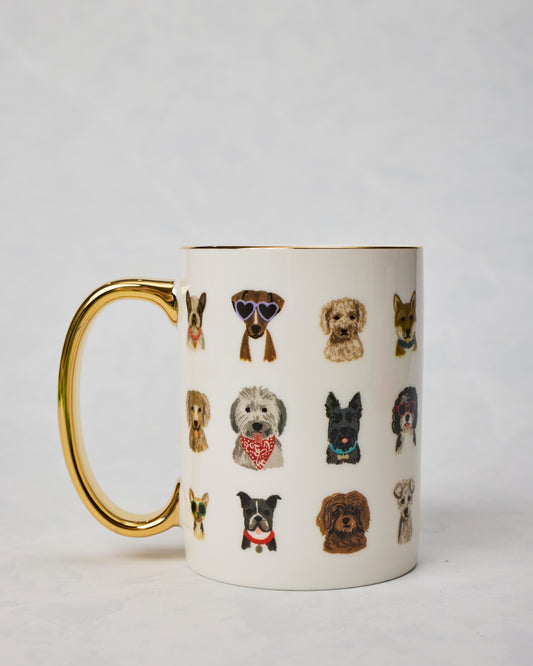 Dog Days porcelain mug shown from the side with a gold handle, gold rim, and rows of illustrated dogs wearing accessories.