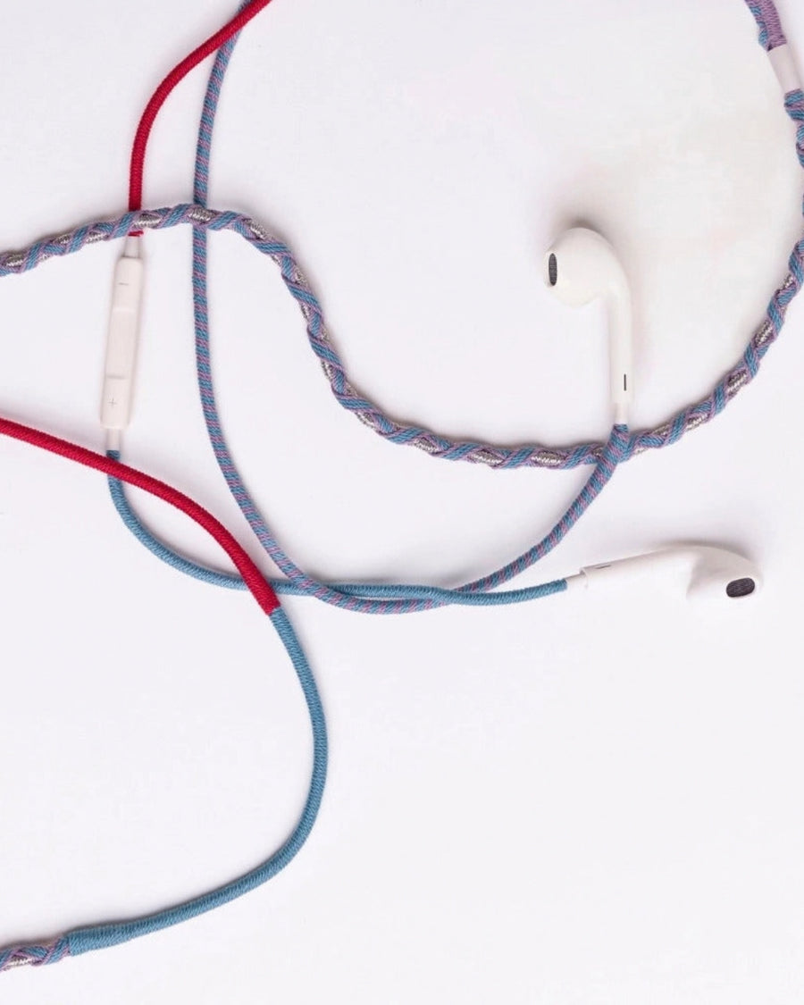 Wired in-ear headphones with braided multicolor cables and a USB-C connector.