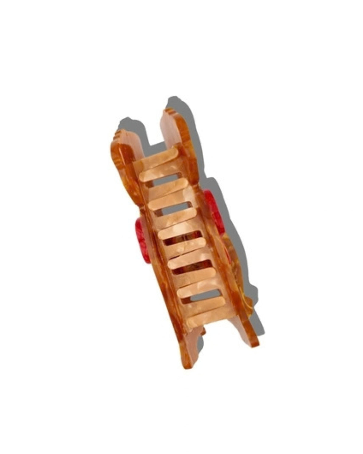 Back view of a brown puppy-shaped hair claw clip, showing the claw mechanism and red bow sides.