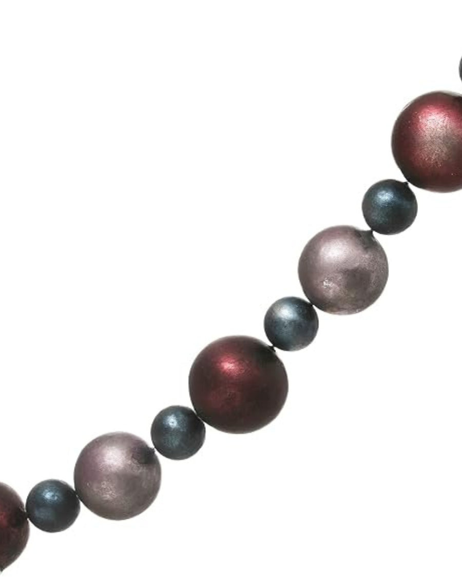 Close-up of the Christmas ball garland showing alternating burgundy, blue-gray, and mauve balls on a string.