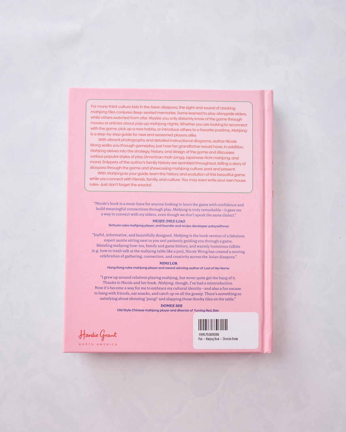 Back cover of the pink Mahjong book with review text, a barcode, and publisher branding.
