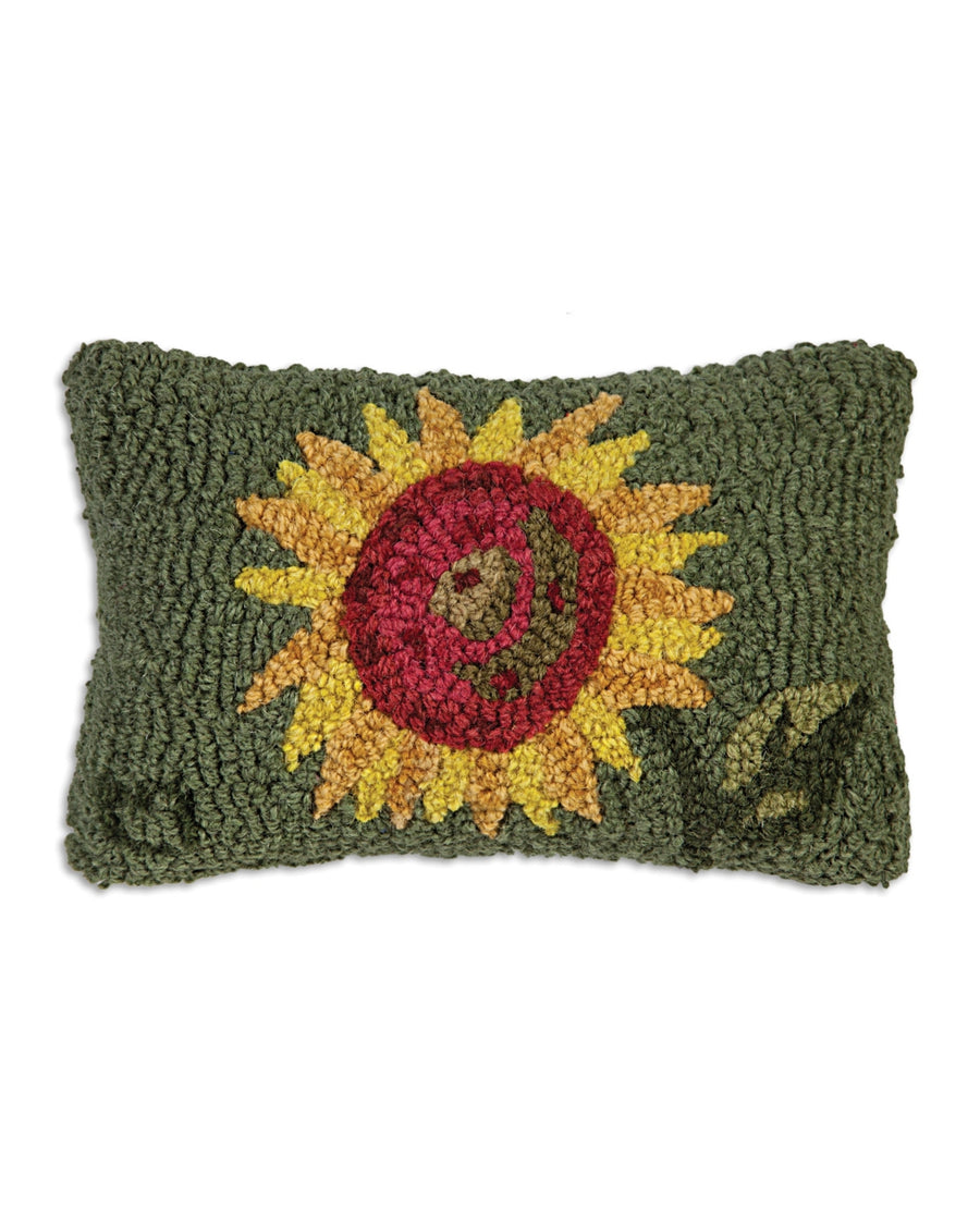 Green rectangular pillow with a large embroidered sunflower and a smiling face design.