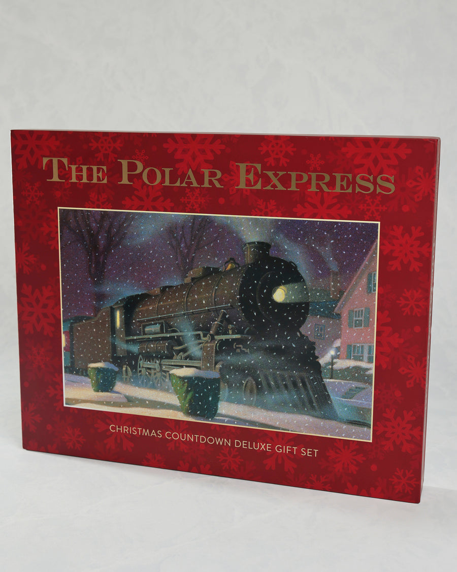 The Polar Express Christmas Countdown Deluxe Gift Set in a red snowflake-patterned box, showing a snowy train illustration.