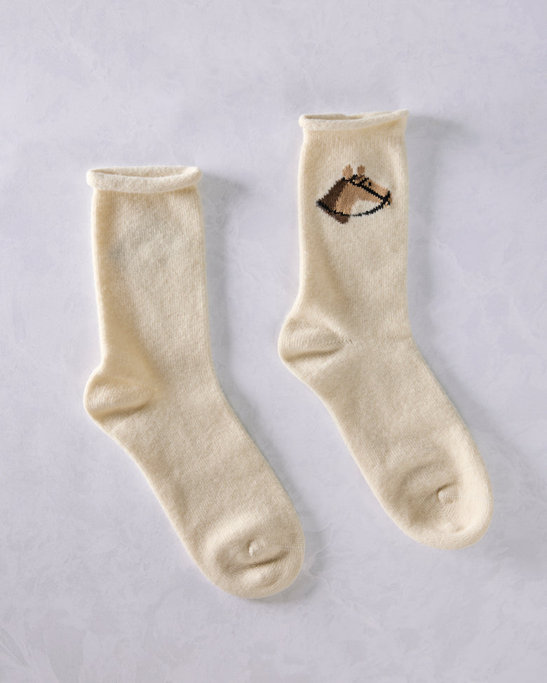 Two ivory crew socks displayed side by side; one shows a horse head embroidery near the top.