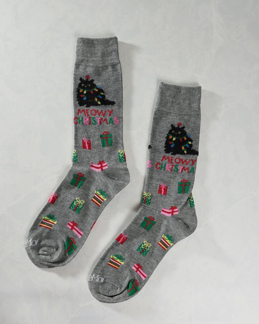 Two gray crew socks displayed separately with Christmas tree cat designs, gifts, and “MEOWY CHRISTMAS” lettering