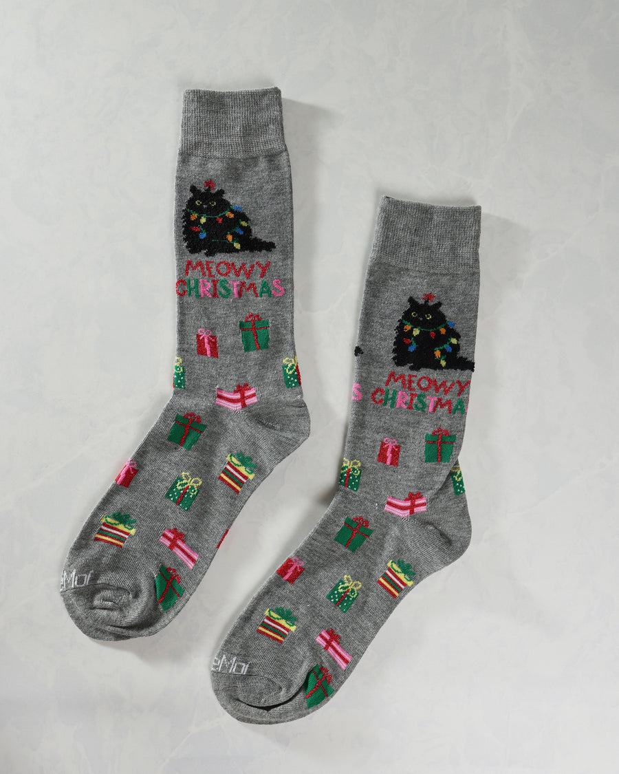Two gray crew socks displayed separately with Christmas tree cat designs, gifts, and “MEOWY CHRISTMAS” lettering