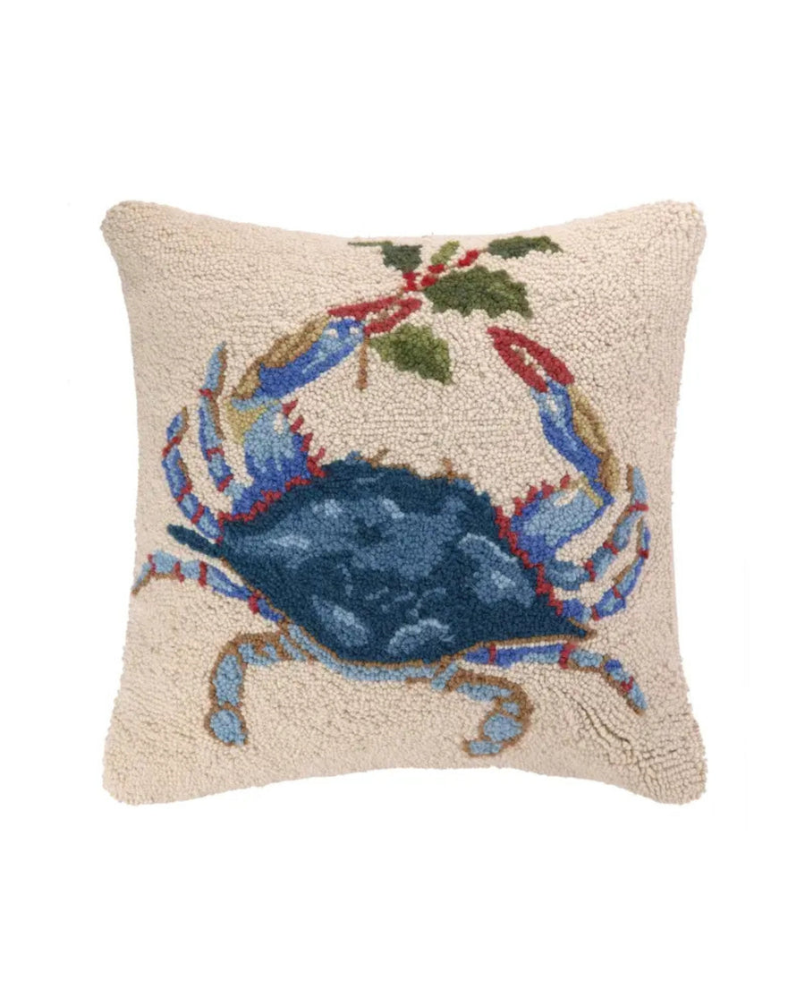 Square ivory hook pillow with a blue crab, red accents, and green foliage design