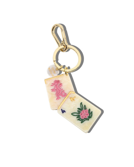 Mahjong-themed flower bag charm and keychain with two cream rectangular tiles, colorful floral artwork, a gold split ring, and carabiner.