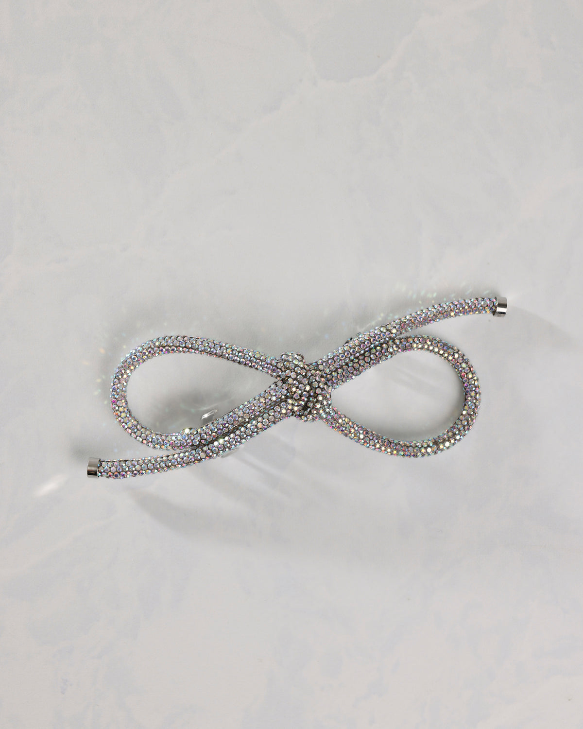 Silver sparkling bow barrette shown from the front