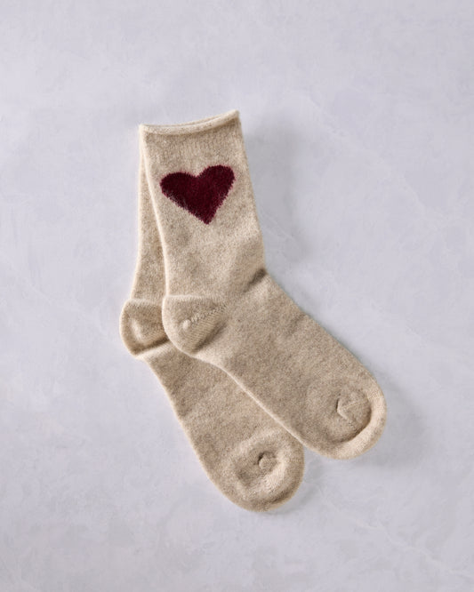 Pair of cream crew socks with burgundy heart motifs, shown overlapping.
