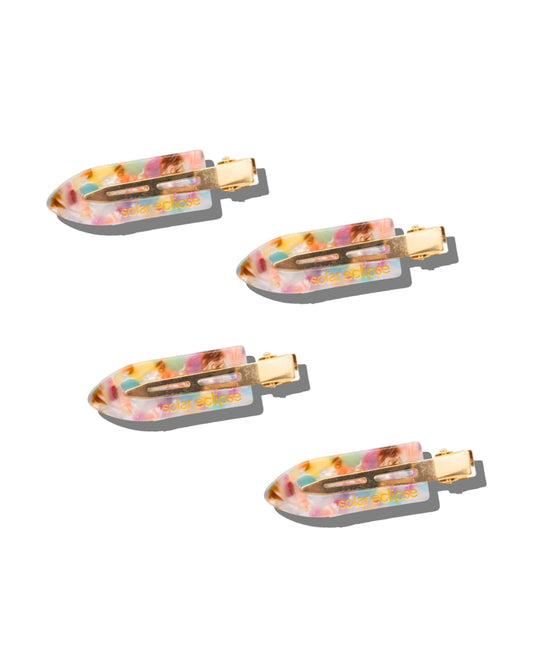 Set of four multicolored hair clips with gold-tone metal fasteners