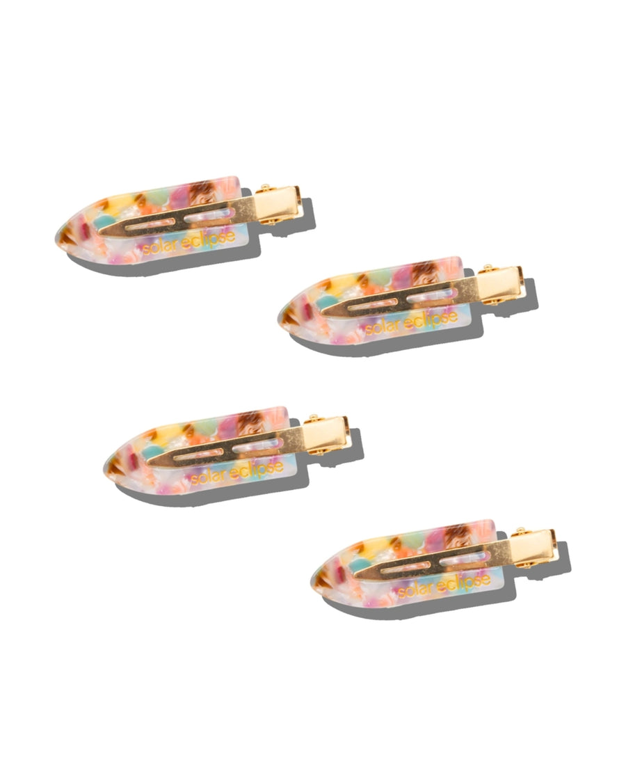 Set of four multicolored hair clips with gold-tone metal fasteners