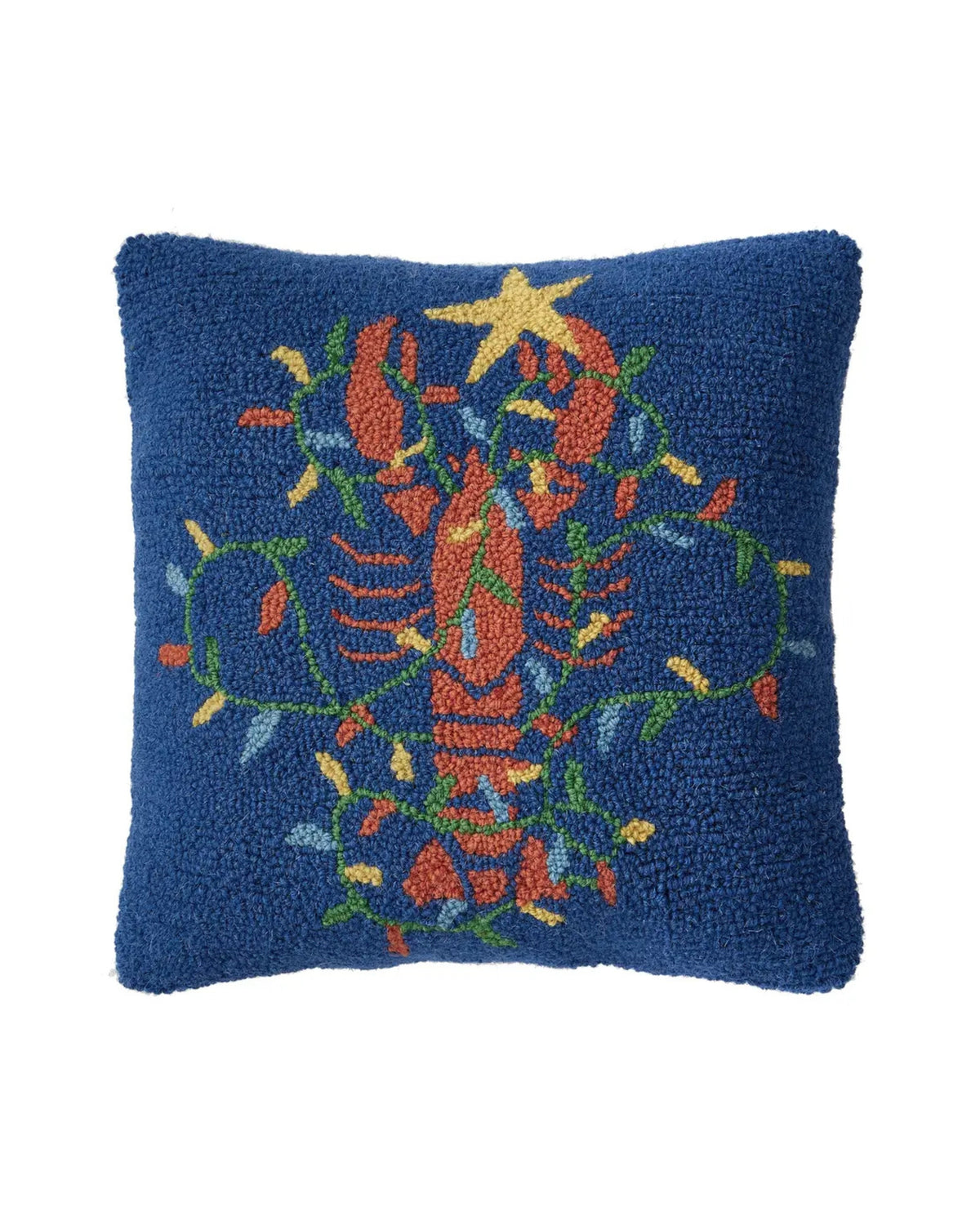 Front view of a navy hooked pillow with a colorful lobster surrounded by leafy botanical accents and topped with a star.