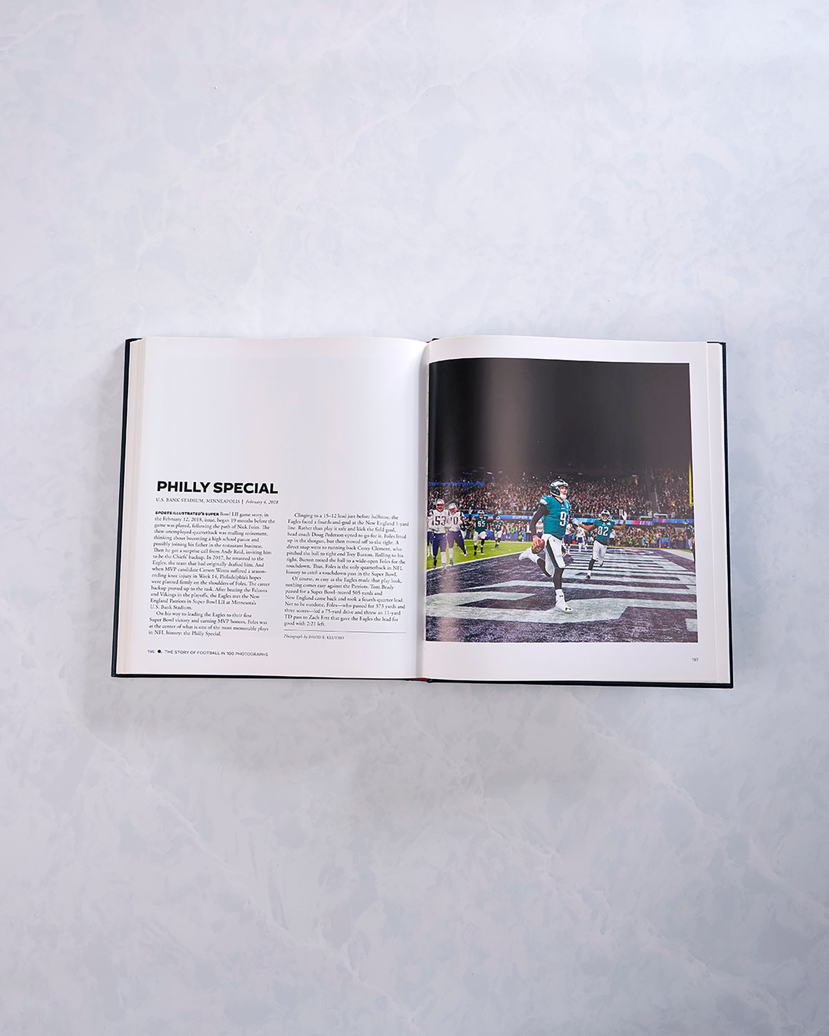 Open football history book showing the article “Philly Special” beside a photograph of a player running in a football stadium.