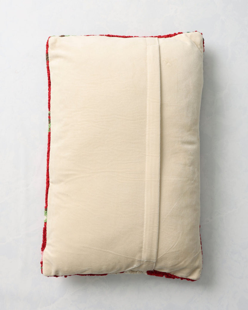 Back of the red Christmas cat pillow with a cream-colored overlapping closure panel.