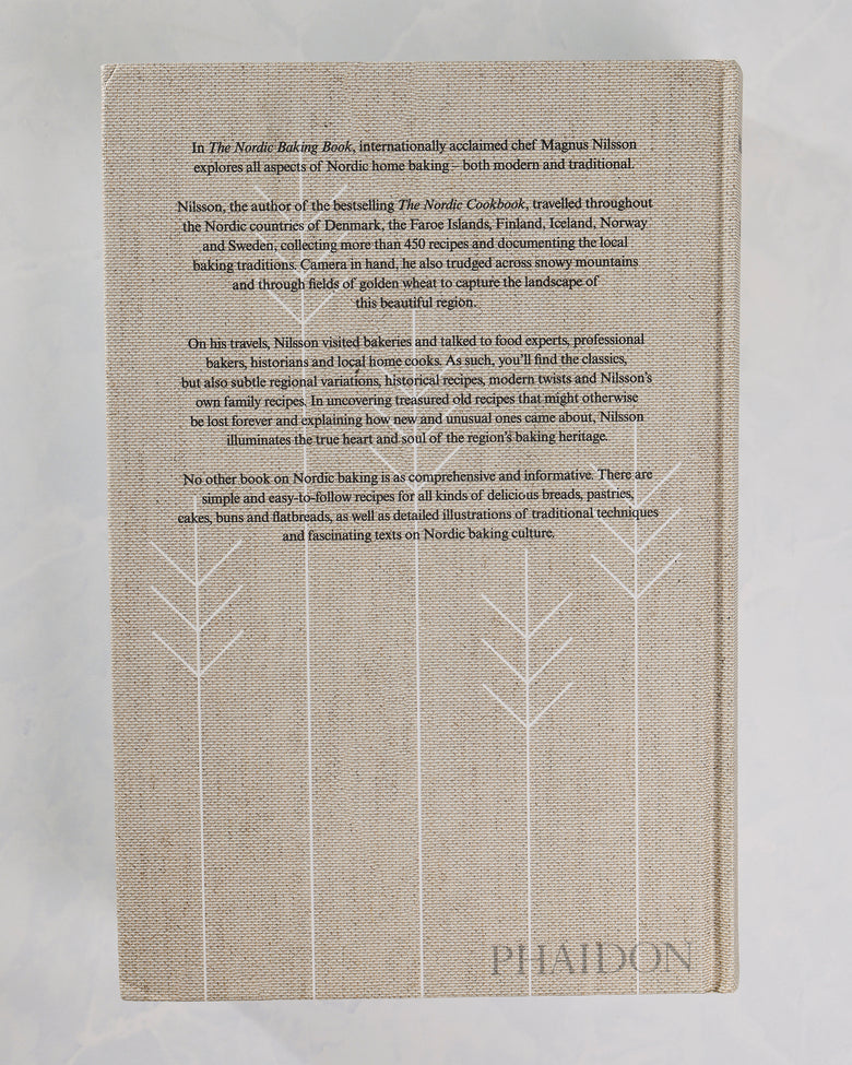 Back cover of The Nordic Baking Book with a centered description of the book and white stylized tree outlines.