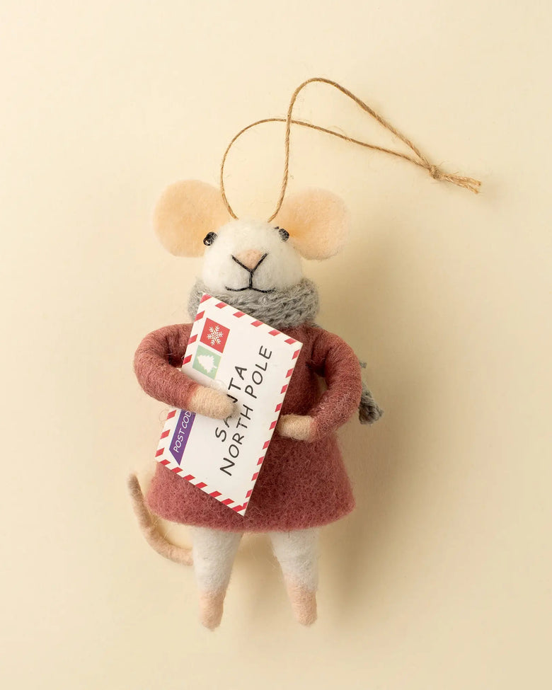 Felt mouse ornament wearing a rust-colored coat and gray scarf while holding an envelope labeled Santa North Pole.