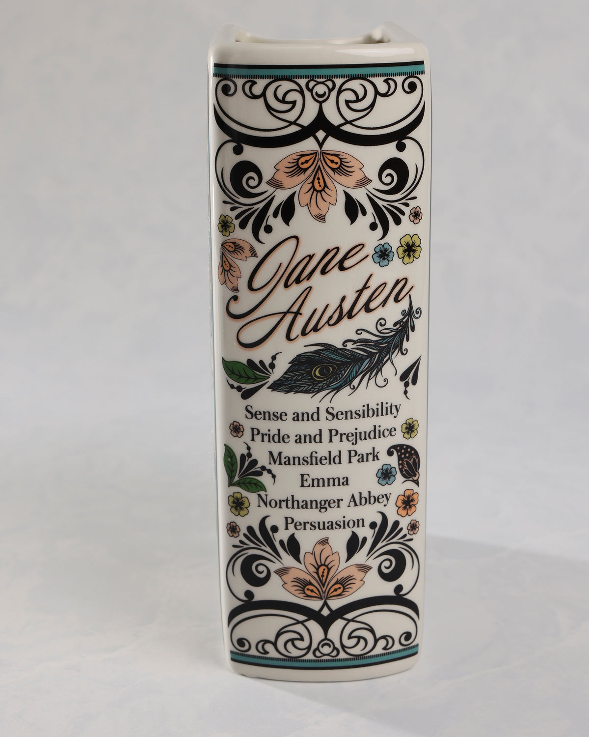 Side view of the Jane Austen book-shaped vase listing Sense and Sensibility, Pride and Prejudice, Mansfield Park, Emma, Northanger Abbey, and Persuasion.