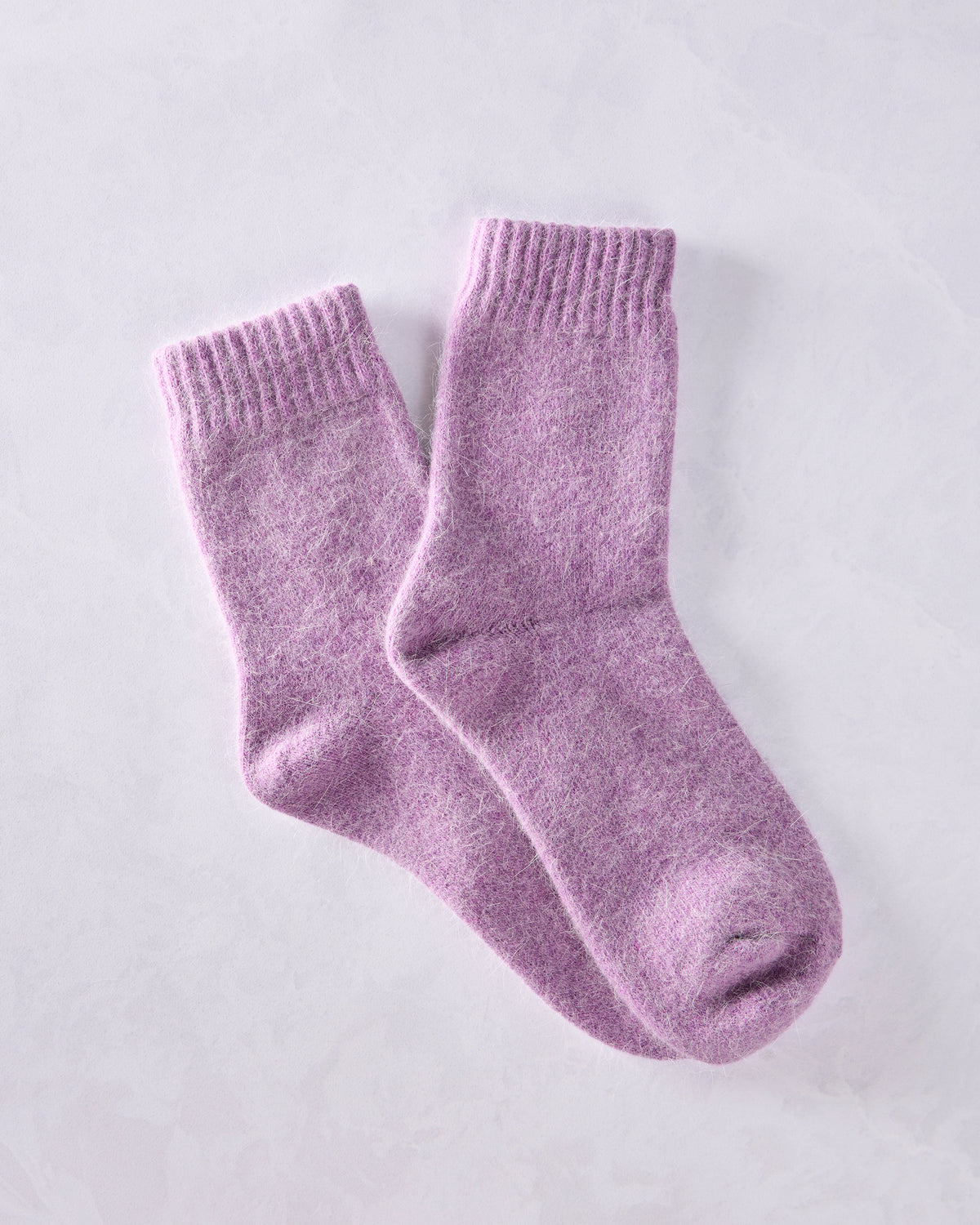 Pair of purple crew socks overlapping at an angle.