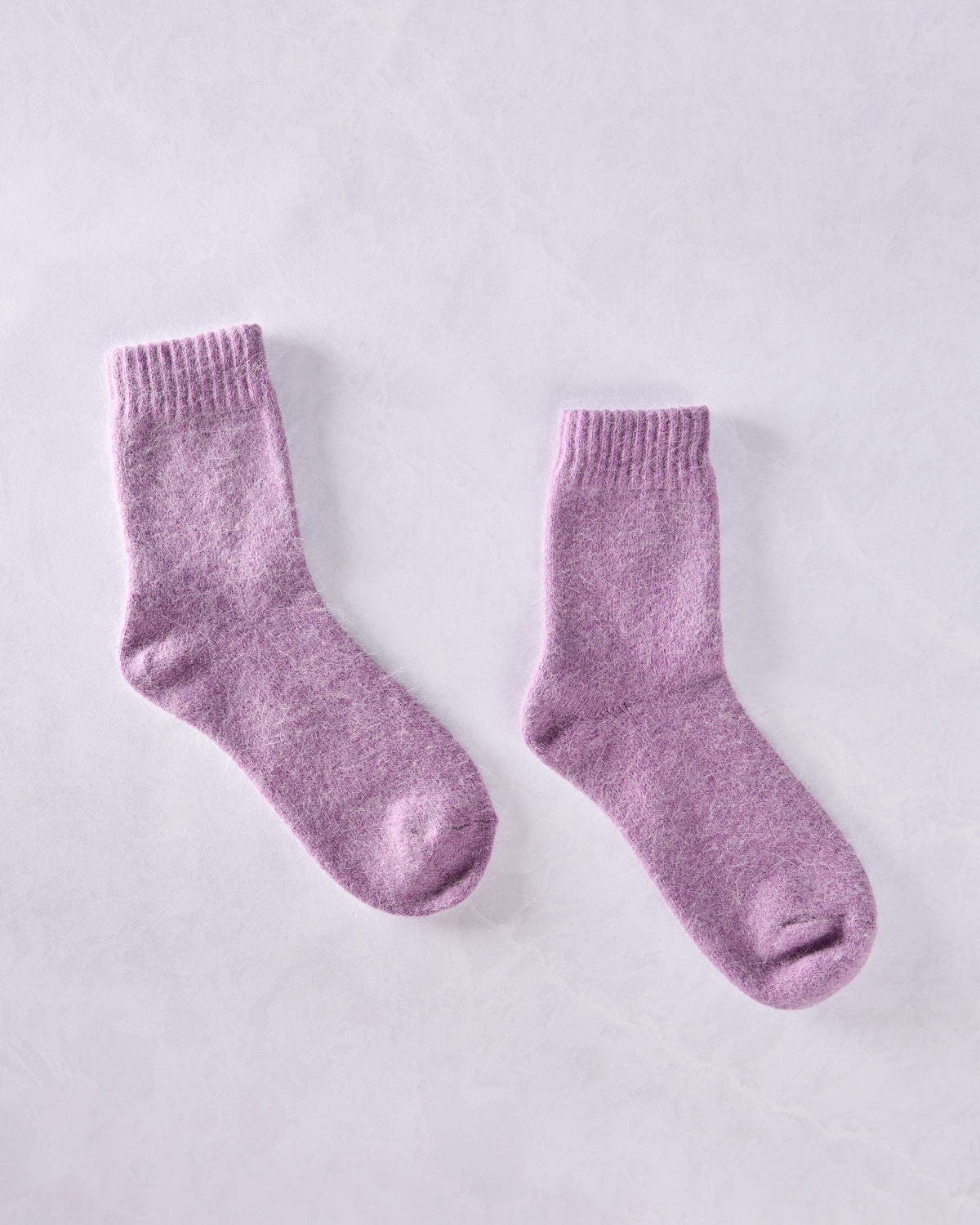 Pair of purple crew socks shown separately on a light background.