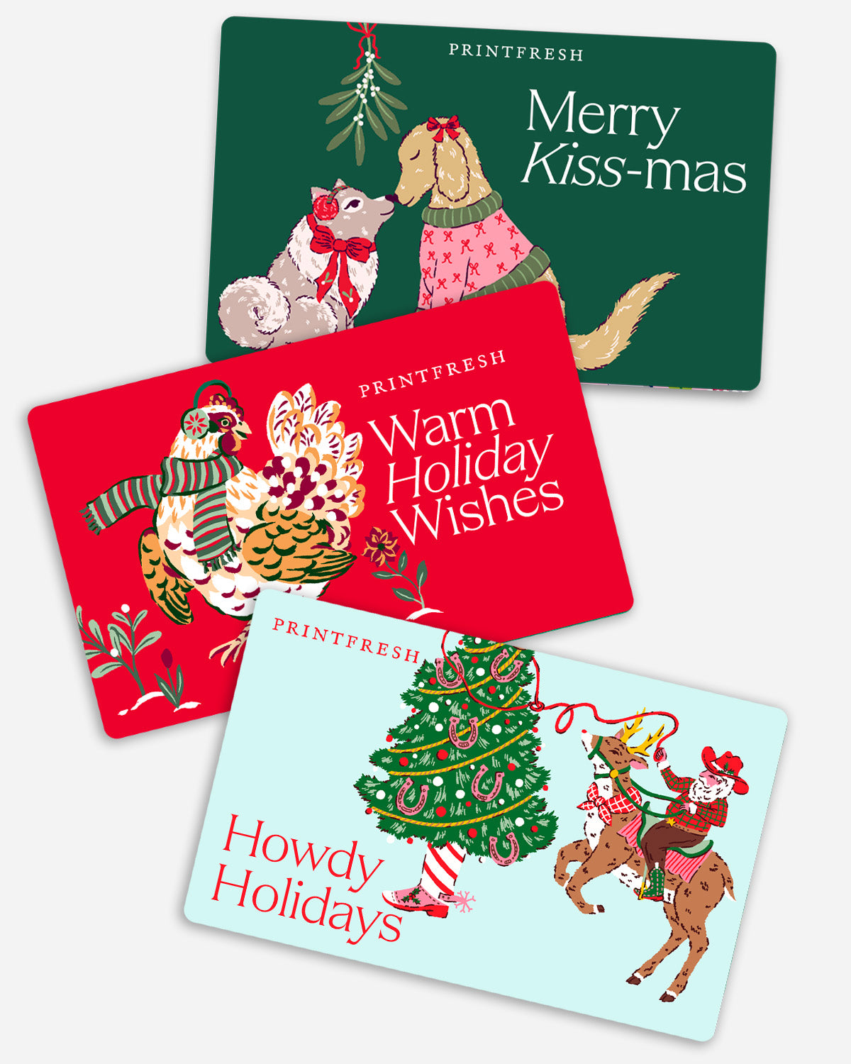 Four illustrated Printfresh holiday gift card designs featuring holiday greetings and festive artwork.