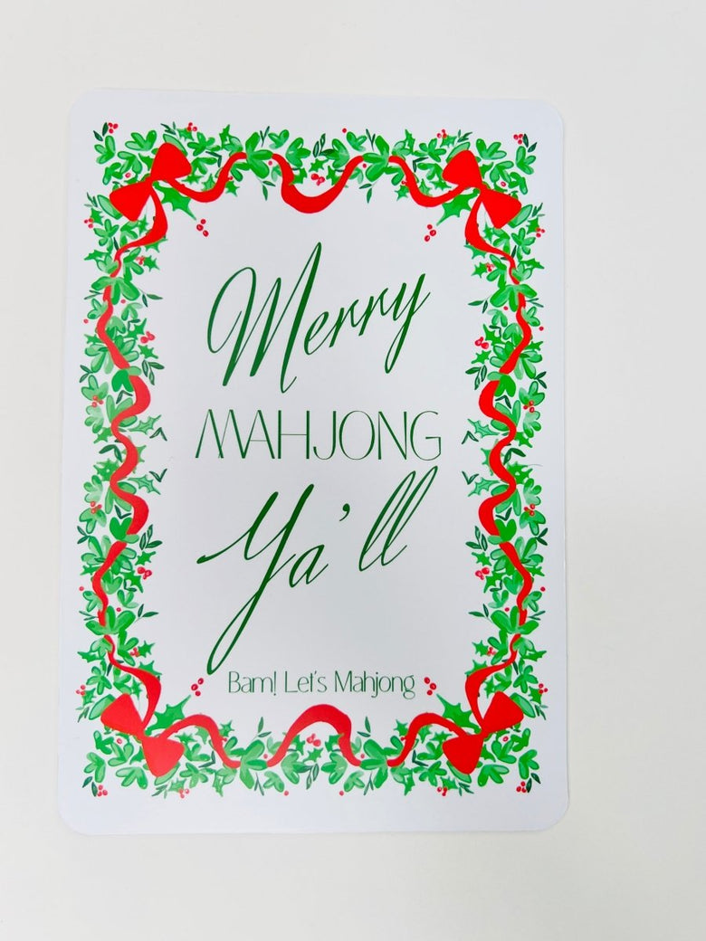 White Christmas Mahjong shuffler card with a leafy green and red ribbon border and the phrase “Merry Mahjong Y’all.”