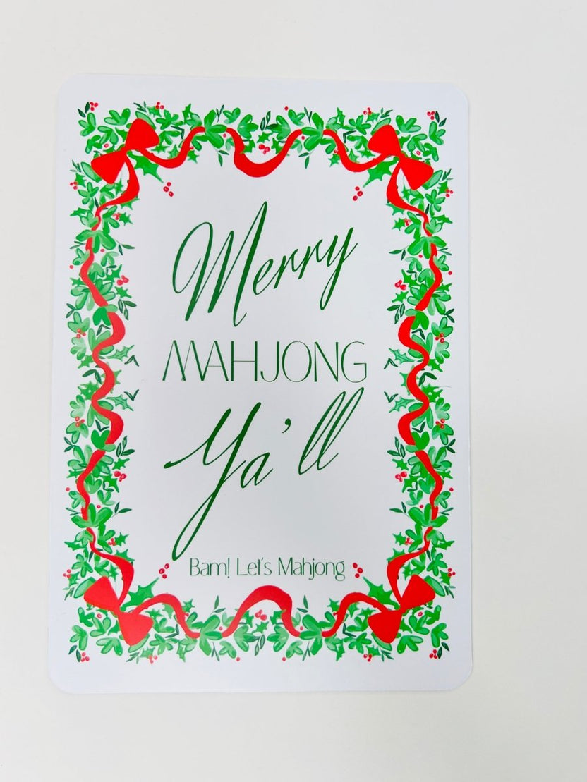 White Christmas Mahjong shuffler card with a leafy green and red ribbon border and the phrase “Merry Mahjong Y’all.”