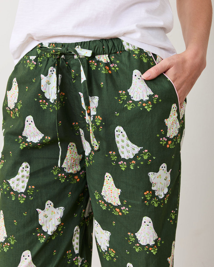 Close view of Gardening Ghosts pajama pants showing the elastic waistband, drawstring, side pocket, and ghost-and-flower print.