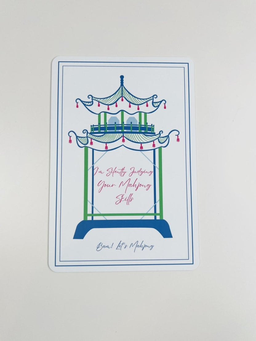 Blue and green Mahjong tile shuffler with a carousel illustration and the phrase “I'm Silently Judging Your Mahjong Skills.”